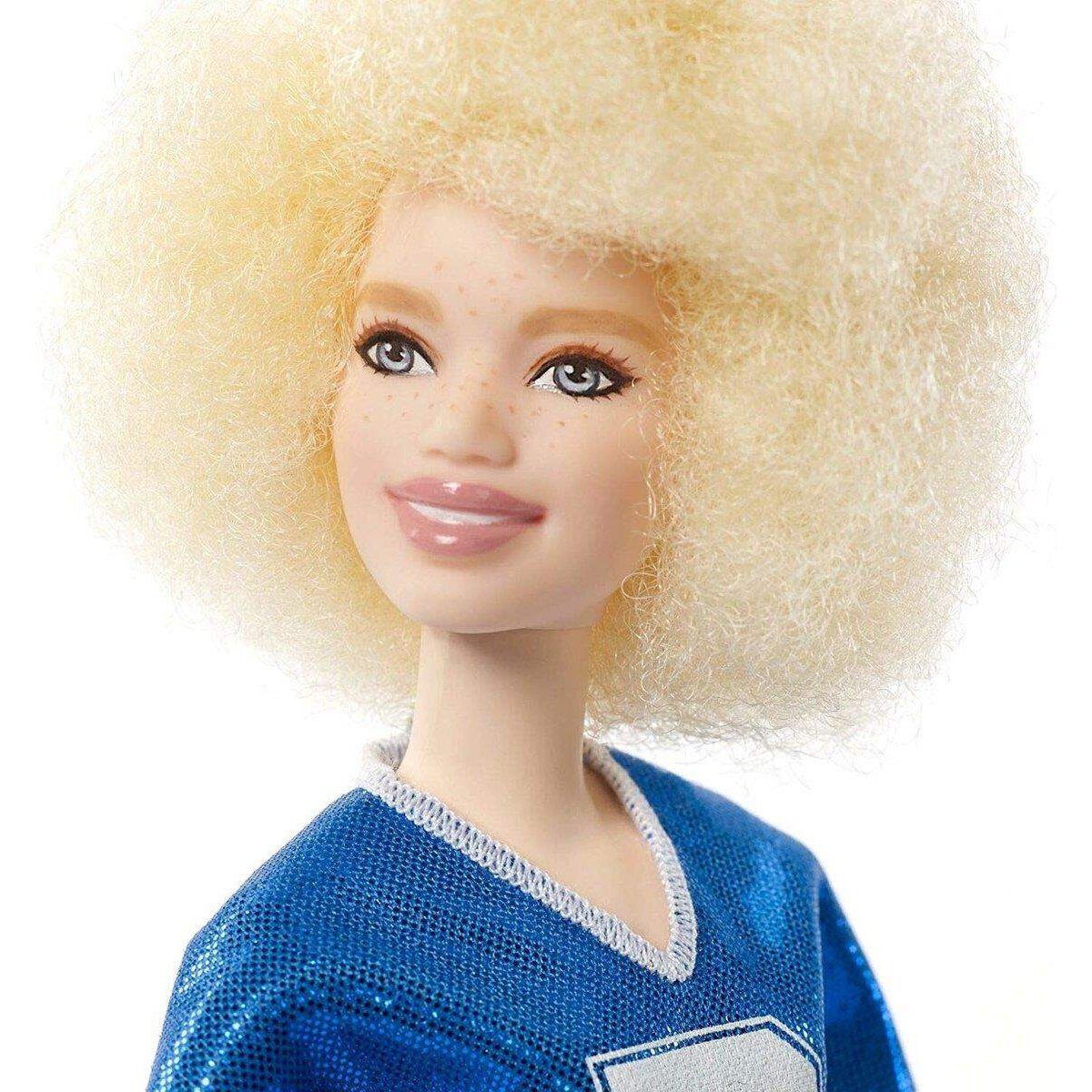 Barbie Fashionistas Puppe im blauen Glitzeroberteil und Rock, mit Karomuster